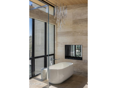 Positioned on a serene hillside Paradise Reserve, this modern