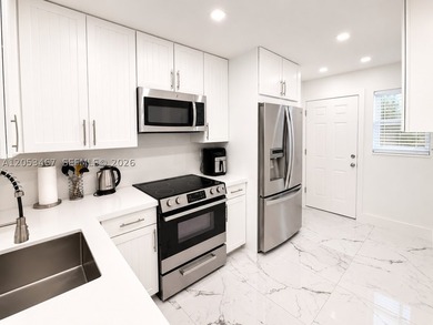 Beautifully remodeled 2-bedroom + den, 2-bath residence has the - photo 2