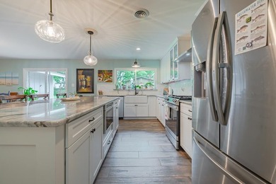 Welcome to this beautifully updated coastal rambler, where - photo 19