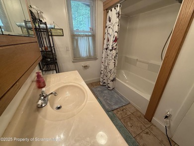 Lakefront living at Lake Winola with 120 feet of lake frontage! - photo 8