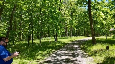 This Iowa acreage for sale offers over 16 mostly wooded acres - photo 5