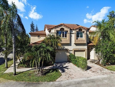 Behind the gates of Boca Pointe, this 3BR/3BA corner townhome - photo 1