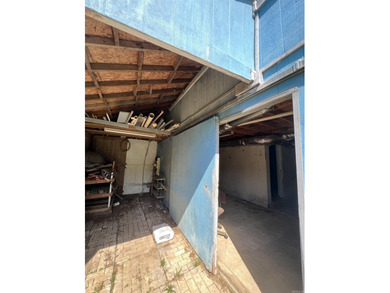 Lakefront fixer-upper with incredible potential! Prime location - photo 11