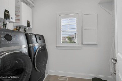 Simply Extraordinary! Completed in 2024, this custom three-story - photo 30