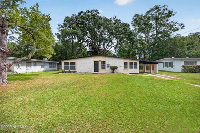 Completely renovated and move-in ready! This solid brick and - photo 1