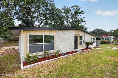 Completely renovated and move-in ready! This solid brick and - photo 3
