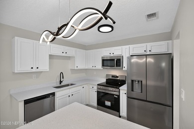 Completely renovated and move-in ready! This solid brick and - photo 10