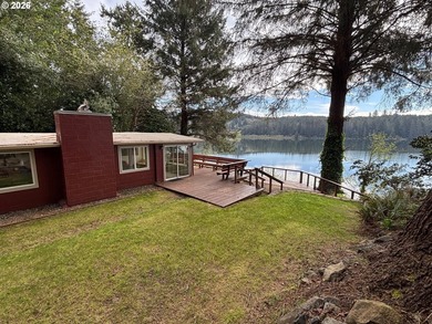 Charming Siltcoos Lakefront cabin with boat dock! End of road - photo 1