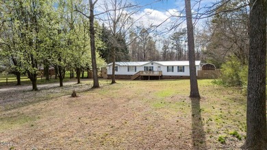 Welcome to this 4-bedroom, 2-bathroom manufactured home situated - photo 4