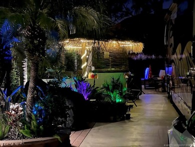 YOUR TROPICAL OASIS AWAITS! Ideally situated near the north - photo 4