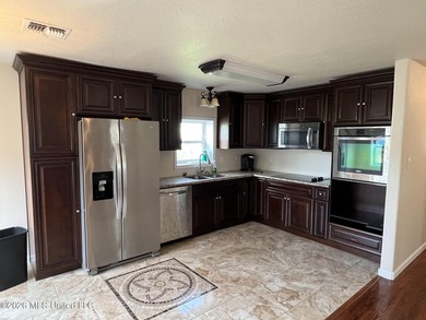 Two level home facing water front canal, fish from your backyard - photo 4