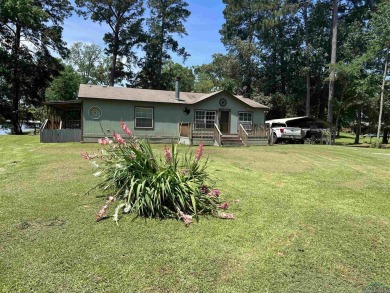This is the place for friends and family gatherings. Go fishing - Lake Home For Sale in Carthage, Texas