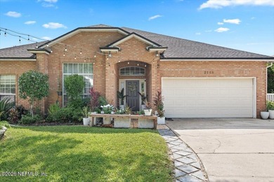 Set on a peaceful waterfront lot in the gated community of The - photo 1