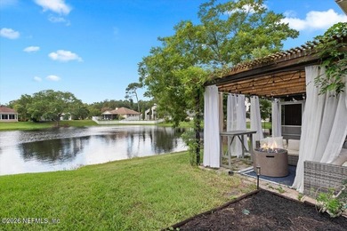 Set on a peaceful waterfront lot in the gated community of The - photo 7