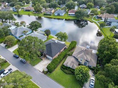 Set on a peaceful waterfront lot in the gated community of The - photo 8