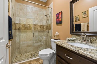 Four-bedroom, three-bathroom, elevated coastal home with a - photo 15