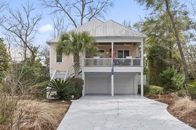 Four-bedroom, three-bathroom, elevated coastal home with a - photo 36