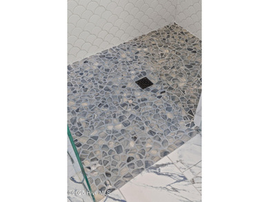 Experience the pinnacle of refined living in this newly