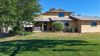 This charming home offers nearly 2,100 finished sq ft with two