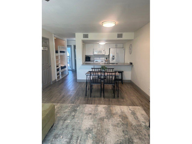 Charming condo featuring fabulous water views on one side and a