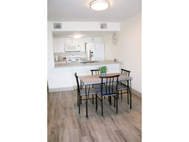 Charming condo featuring fabulous water views on one side and a