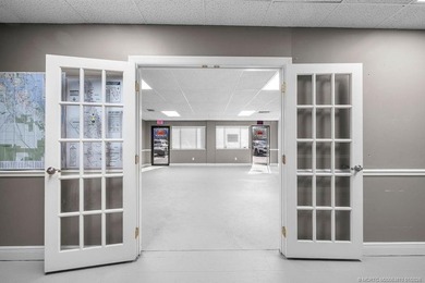 Bright, open showroom with newly applied SunDek finished floors - photo 2