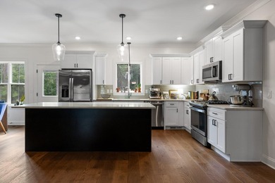 Tucked away on a quiet, country road, this charming like-new - photo 12