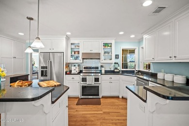 Set on a .66-acre waterfront lot along tidal Battery Creek, this - photo 21