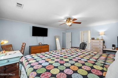 Set on a .66-acre waterfront lot along tidal Battery Creek, this - photo 31