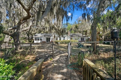 Set on a .66-acre waterfront lot along tidal Battery Creek, this - photo 48