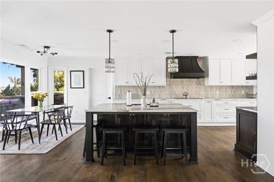 Nestled in the gated community of Dutch Island, this beautifully - photo 5