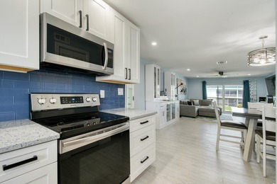 Experience waterfront living in this beautifully updated - photo 8
