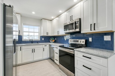 Experience waterfront living in this beautifully updated - photo 9