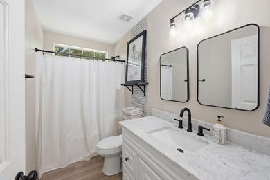 Perfectly positioned on a beautiful corner lot in the highly - photo 26