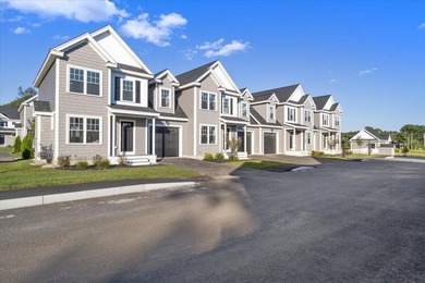 Like-new luxury 2-bedroom, 2.5-bath end-unit townhome in an - photo 1