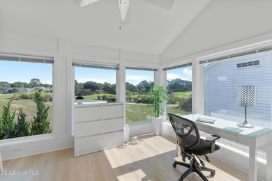 This townhome offers a spectacular water and golf view and is - photo 12