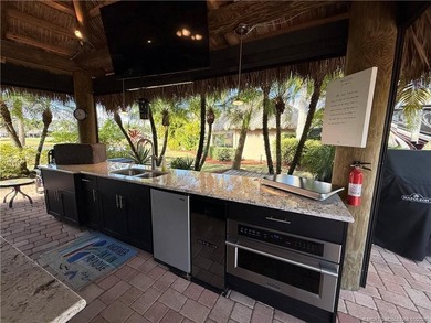 Located on the large lake with double fountains, this is truly - photo 10