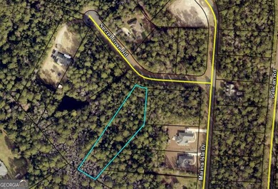 THIS SIZABLE HOME SITE IS LOCATED IN THE BEAUTIFUL, TREE LINED - photo 2