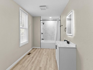This beautifully renovated 5-bedroom, 2-bath home has been - photo 14