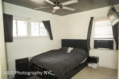 This 6 bedroom, 3-bathroom home features a cozy wood-burning - photo 12