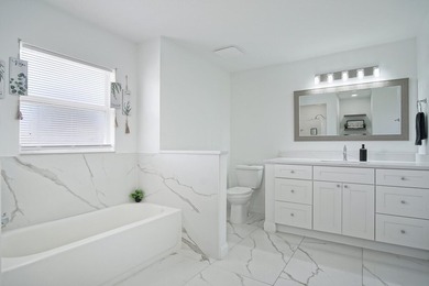 This stunning pool home has it all! Gorgeous plank tile flooring - photo 14