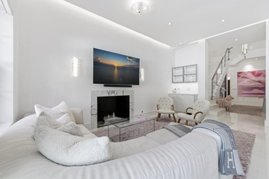 Built in 2020, this chic in-town home on the ocean block of