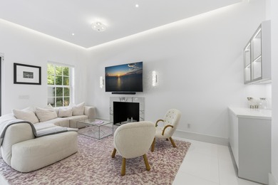 Built in 2020, this chic in-town home on the ocean block of