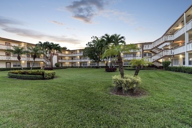 Welcome to this inviting 2-bedroom, 1.5-bathroom condominium - photo 1