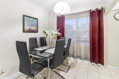Welcome to this inviting 2-bedroom, 1.5-bathroom condominium - photo 2