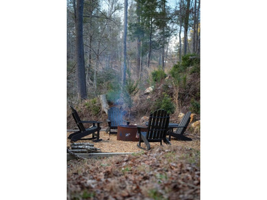 Set on 8.5 pristine acres, this extraordinary custom-built cabin