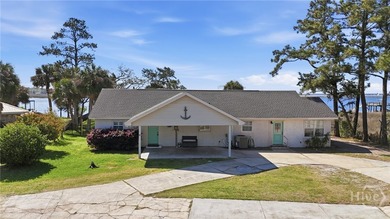$20K Price Drop!! Tucked away on a quiet peninsula along the - photo 4