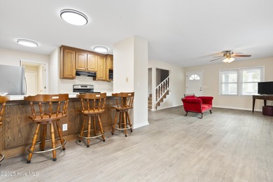 This spacious coastal home sits in the middle of a generous