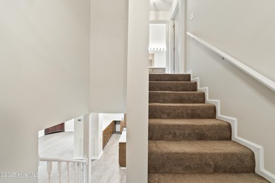 This spacious coastal home sits in the middle of a generous