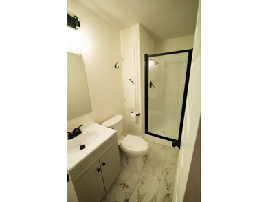 Totally remodeled - new roof, flooring, paint, appliances - photo 22